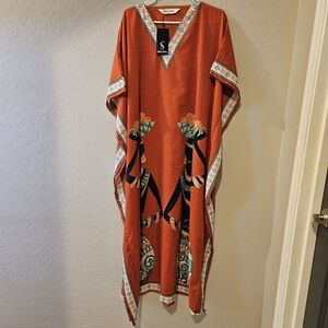 Vibrant Orange Maxi Dress with Artistic Trim